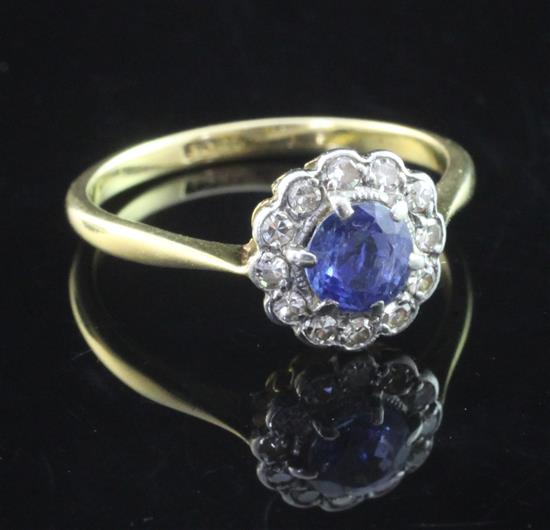 A 1940s/1950s 18ct gold, sapphire and diamond cluster ring, size O.